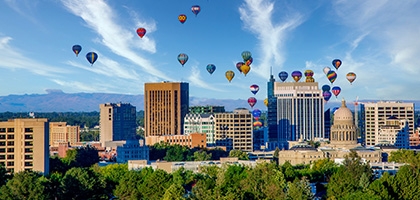 Downtown skyline in Boise, Idaho with hot air balloons.