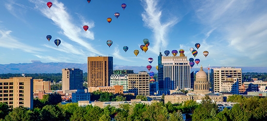 Downtown skyline in Boise, Idaho with hot air balloons.
