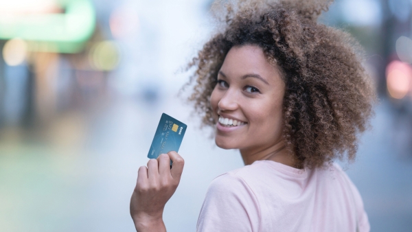 Photo of a woman and credit card.