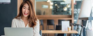 Businesswoman using her laptop in the office.