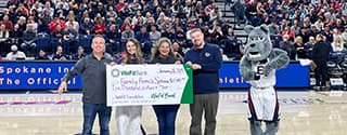 WaFd employees presenting Family Promise Spokane a check.