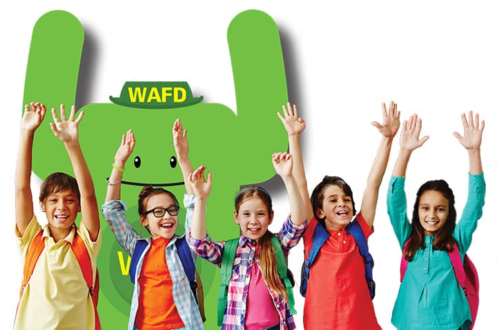 Happy schoolkids with hands raised with Walt.