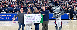 WaFd employees presenting Family Promise Spokane a check.