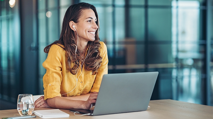 Woman smiling while hearing music