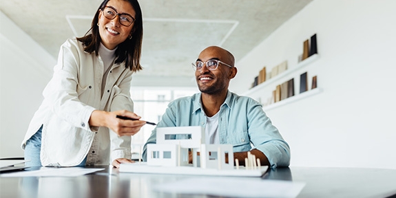 Colleagues looking at an architectural model