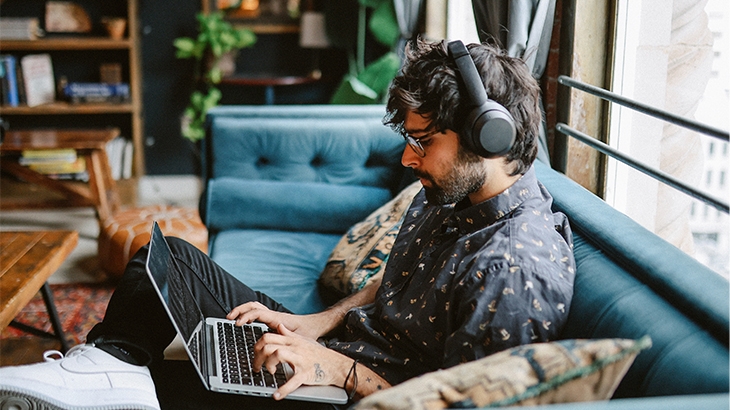 Entrepreneur working remotely on his laptop.