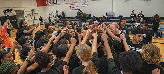 Seattle Storm team high-five at Denali Basketball Clinic.