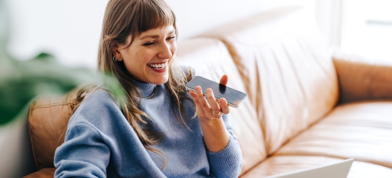 Cheerful woman speaking on a cellphone.