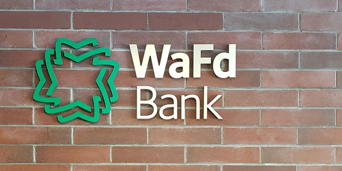 WaFd Bank sign on a brick wall.