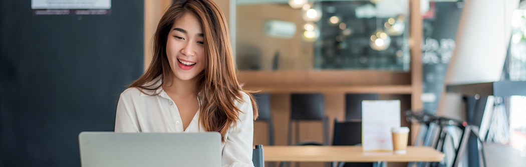 Businesswoman using her laptop in the office.
