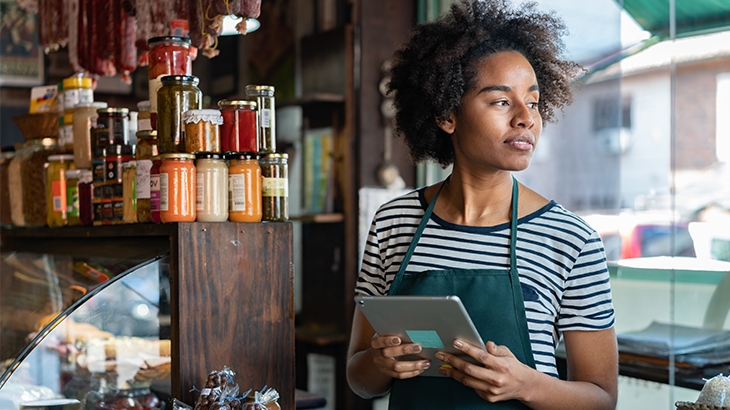 Business owner in her delicatessen.