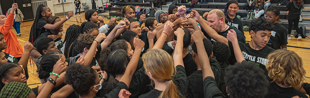Seattle Storm team high-five at Denali Basketball Clinic.
