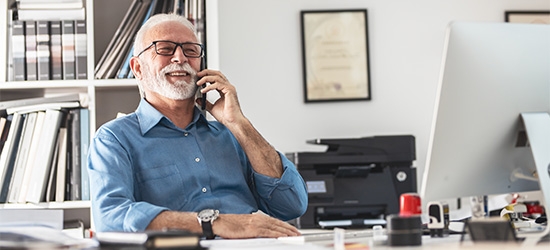 Senior businessman on mobile phone