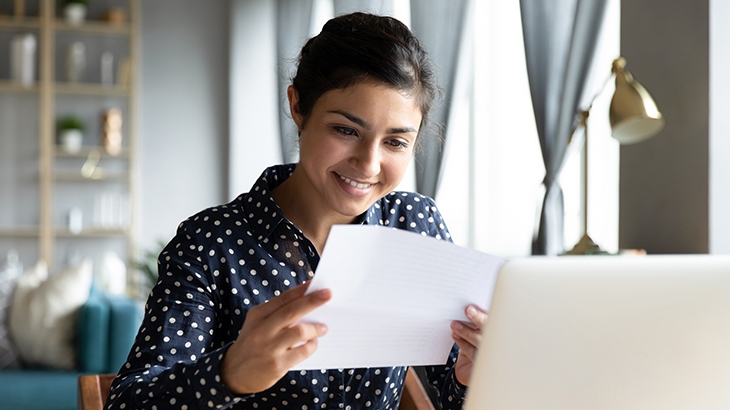 Woman reading bank statement letter