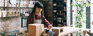 Young entrepreneur shipping products.