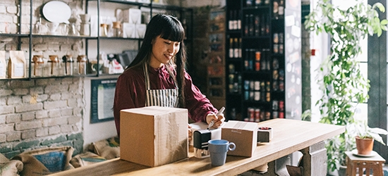 Young entrepreneur shipping products.