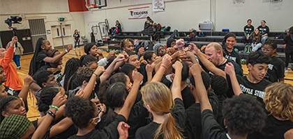 Seattle Storm team high-five at Denali Basketball Clinic.