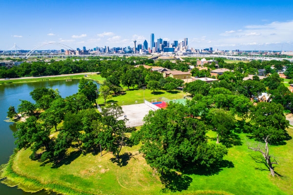 Dallas Texas suburban park with downtown skyline in background.