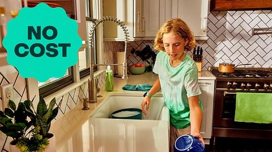 A teen doing the dishes.