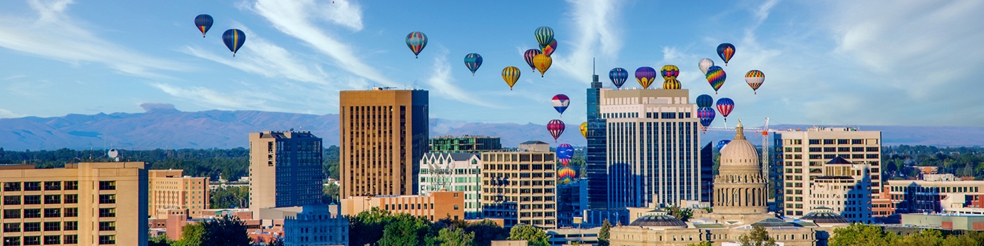 Downtown skyline in Boise, Idaho with hot air balloons.