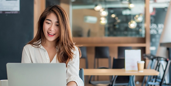Businesswoman using her laptop in the office.