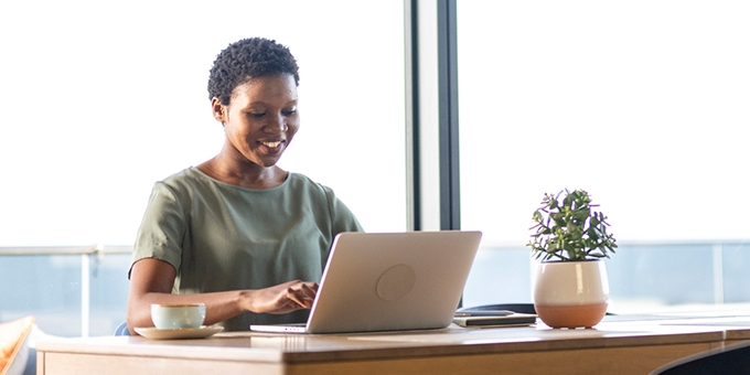 Businesswoman working on laptop in office