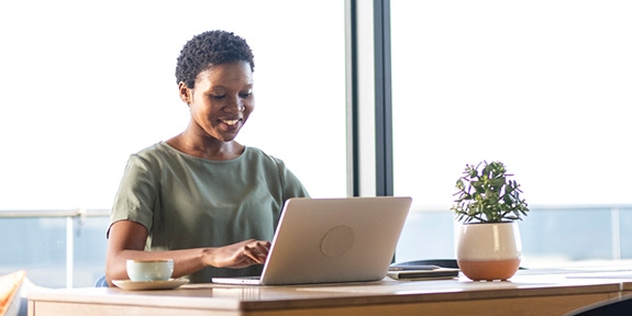 Businesswoman working on laptop in office