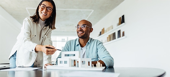 Colleagues looking at an architectural model