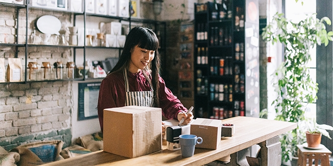Young entrepreneur shipping products.