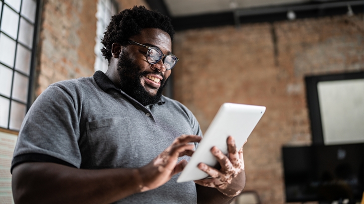 A businessman using a tablet.