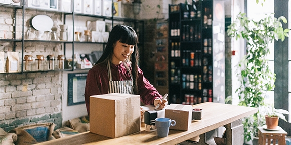 Young entrepreneur shipping products.