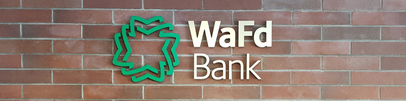 WaFd Bank sign on a brick wall.