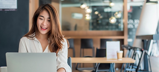 Businesswoman using her laptop in the office.