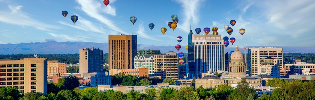 Downtown skyline in Boise, Idaho with hot air balloons