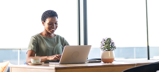 Businesswoman working on laptop in office