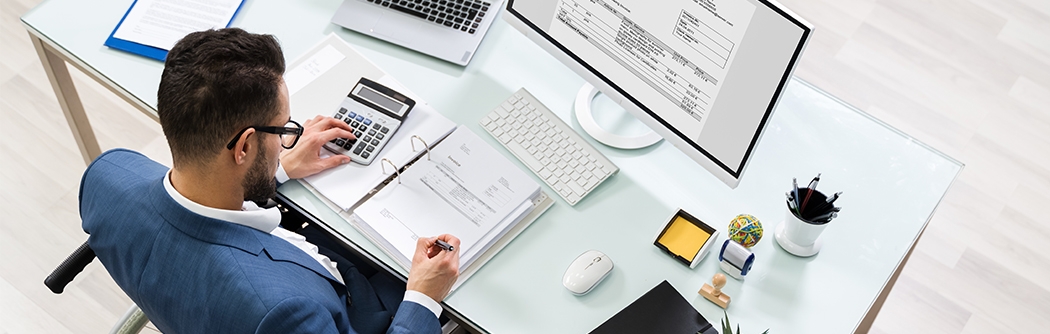 Businessman in a wheelchair at a desk.