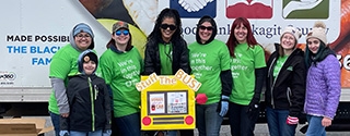 WaFd employees and other volunteers for Stuff the Bus Helping Hands in Mount Vernon, Washington