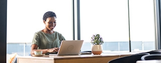 Businesswoman working on laptop in office