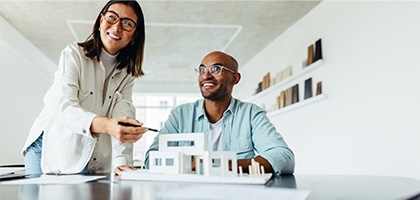 Colleagues looking at an architectural model