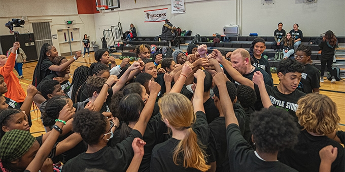 Seattle Storm team high-five at Denali Basketball Clinic.