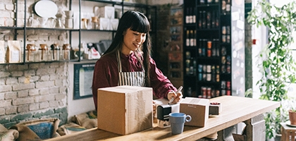 Young entrepreneur shipping products.