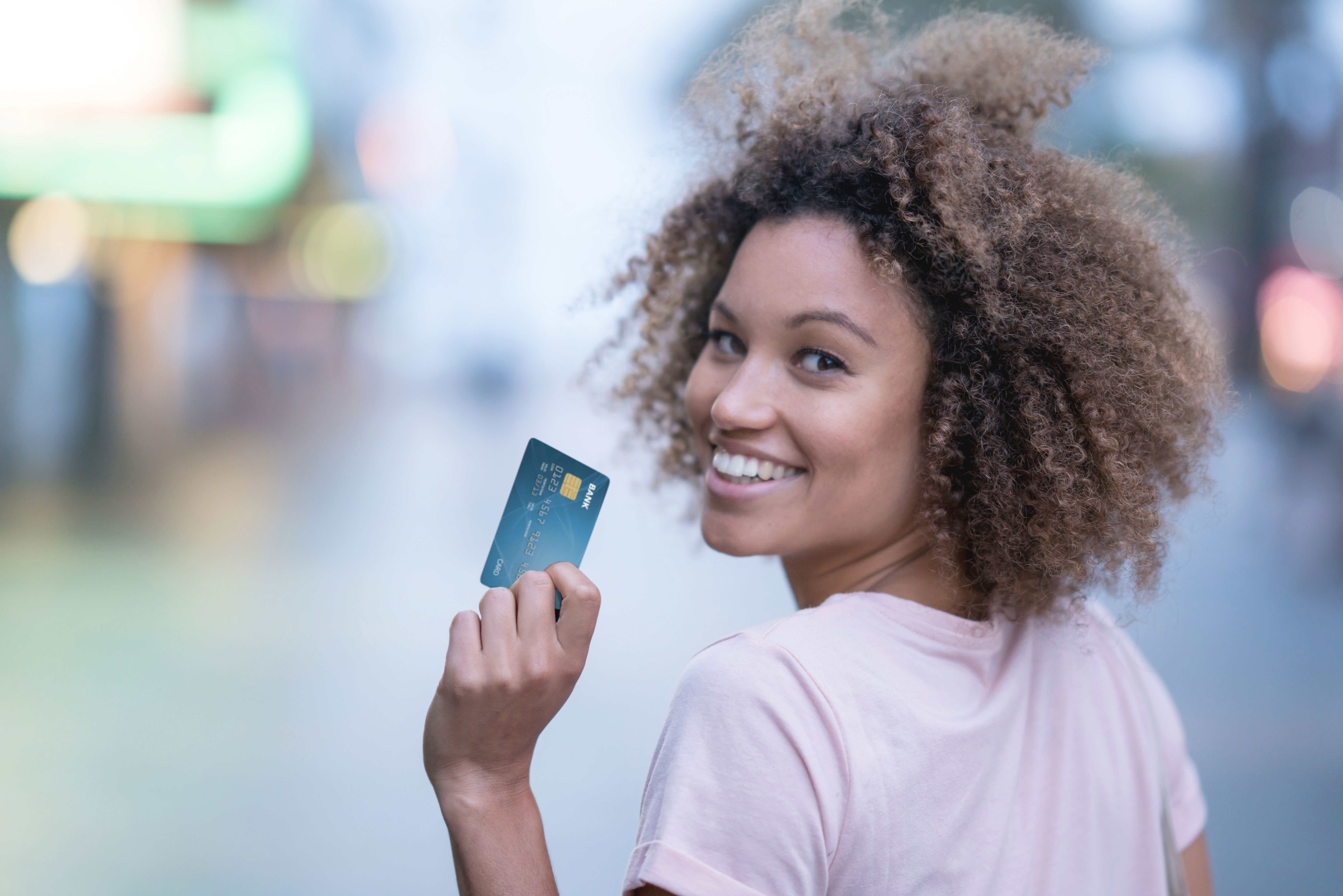 Photo of a woman and credit card