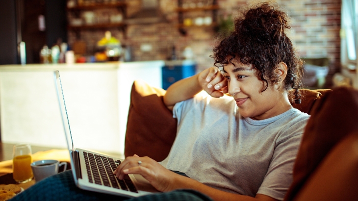 Woman using a laptop at home