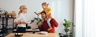 Family playing while cooking in the kitchen