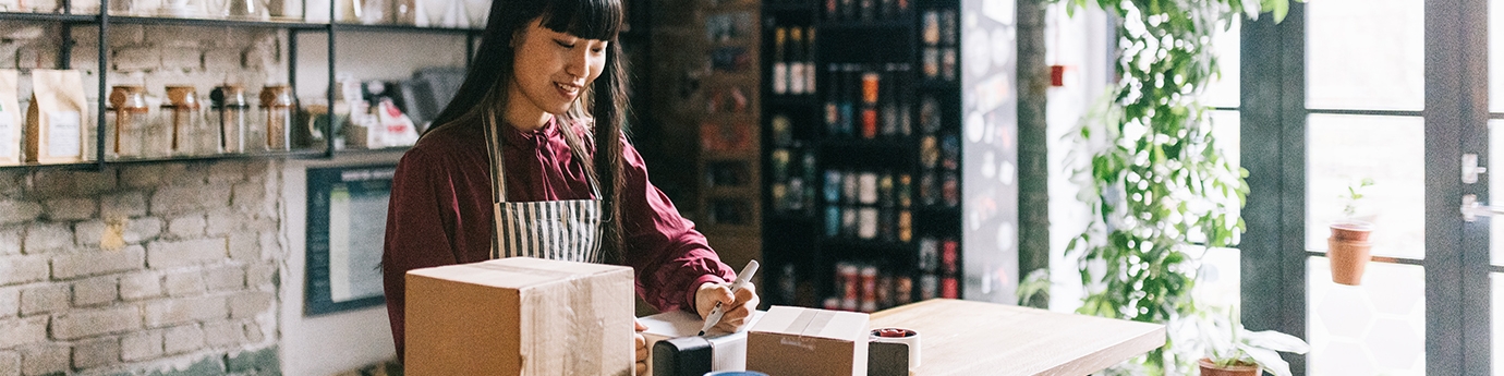 Young entrepreneur shipping products.