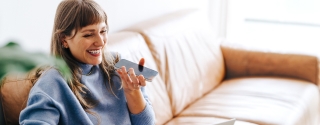 Cheerful woman speaking on a cellphone.