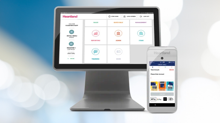 Heartland integrated payments dashboard on a monitor and mobile phone.
