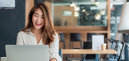 Businesswoman using her laptop in the office.