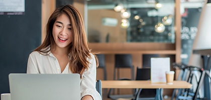 Businesswoman using her laptop in the office